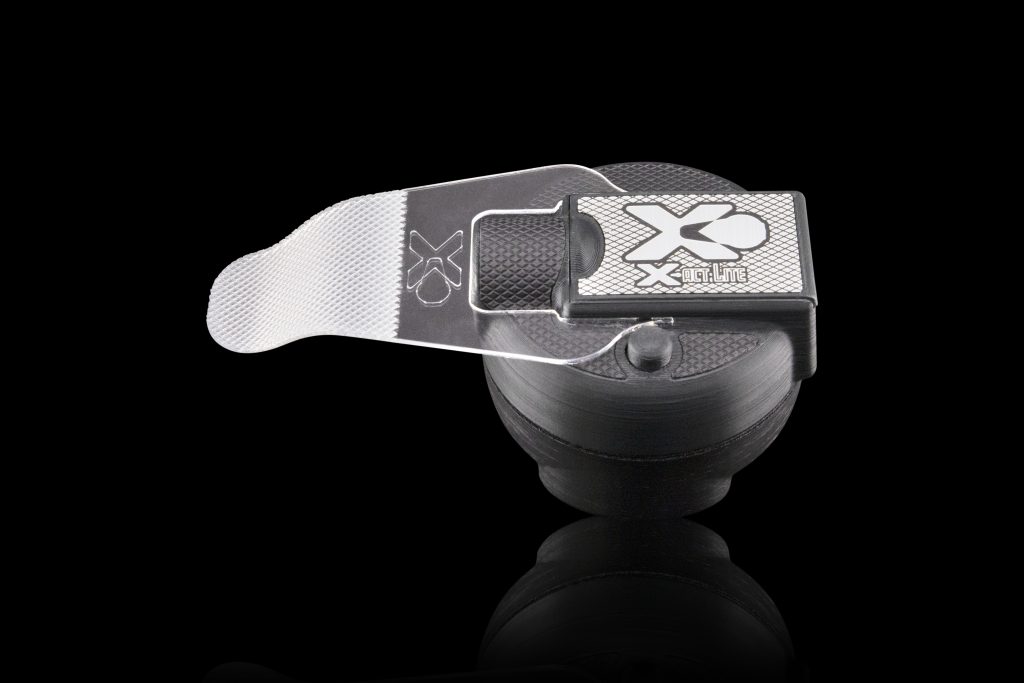 Close-up image of the XactLite Light precision tool designed for cutting window film patterns by backlighting the film, featuring its durable construction and compact design and reflector